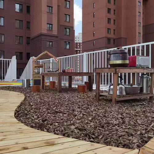 碳化软木屑游乐场学校滑梯铺面专用软木轻木颗粒覆盖物厂家直销