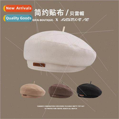 The letters of the small label beret British fashion tempera