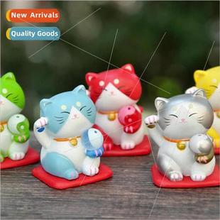 hands office ornaments beckoning small cat toy Cartoon boy