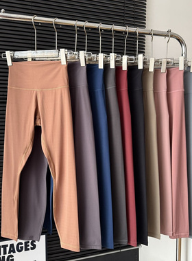 青岛外贸alig磨毛女士24寸瑜伽裤高腰提臀健身裤腰印花速干九分裤