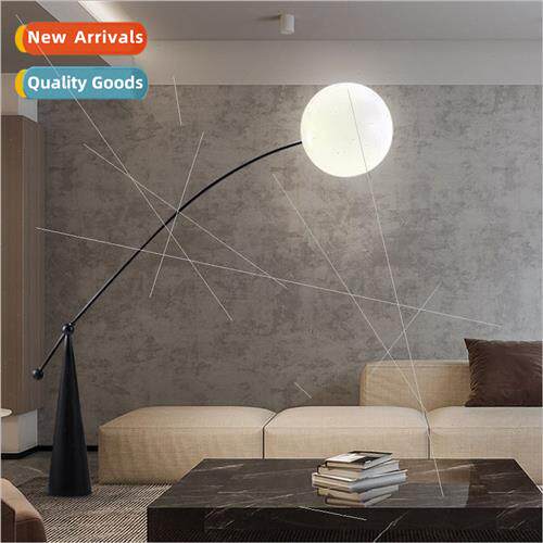 Scandinavian sofa next to living room floor lamp modern mini
