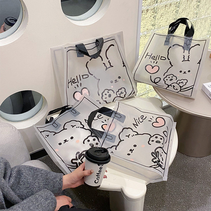 新款 高档服装店透明卡通手提袋塑料衣服购物礼物打包袋