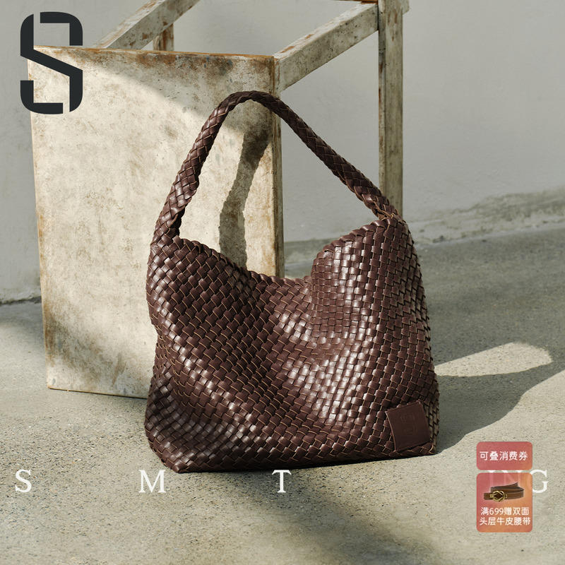 西木汀2025新款头层牛皮水桶包包女大容量高级感编织包通勤单肩