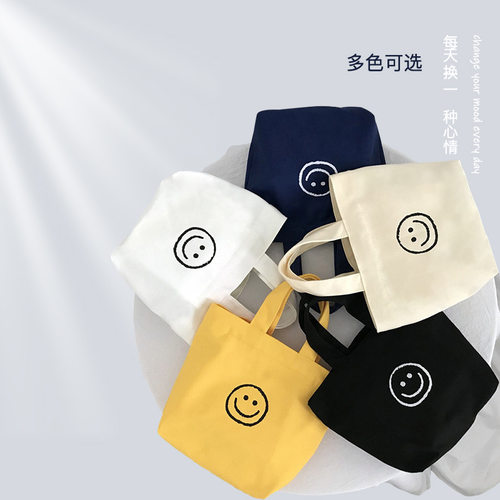 可爱笑脸新款小包手提帆布包零食书本便当小包手提袋字