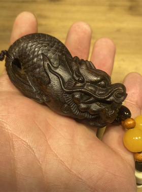 沉香木雕刻鱼化龙男手把件