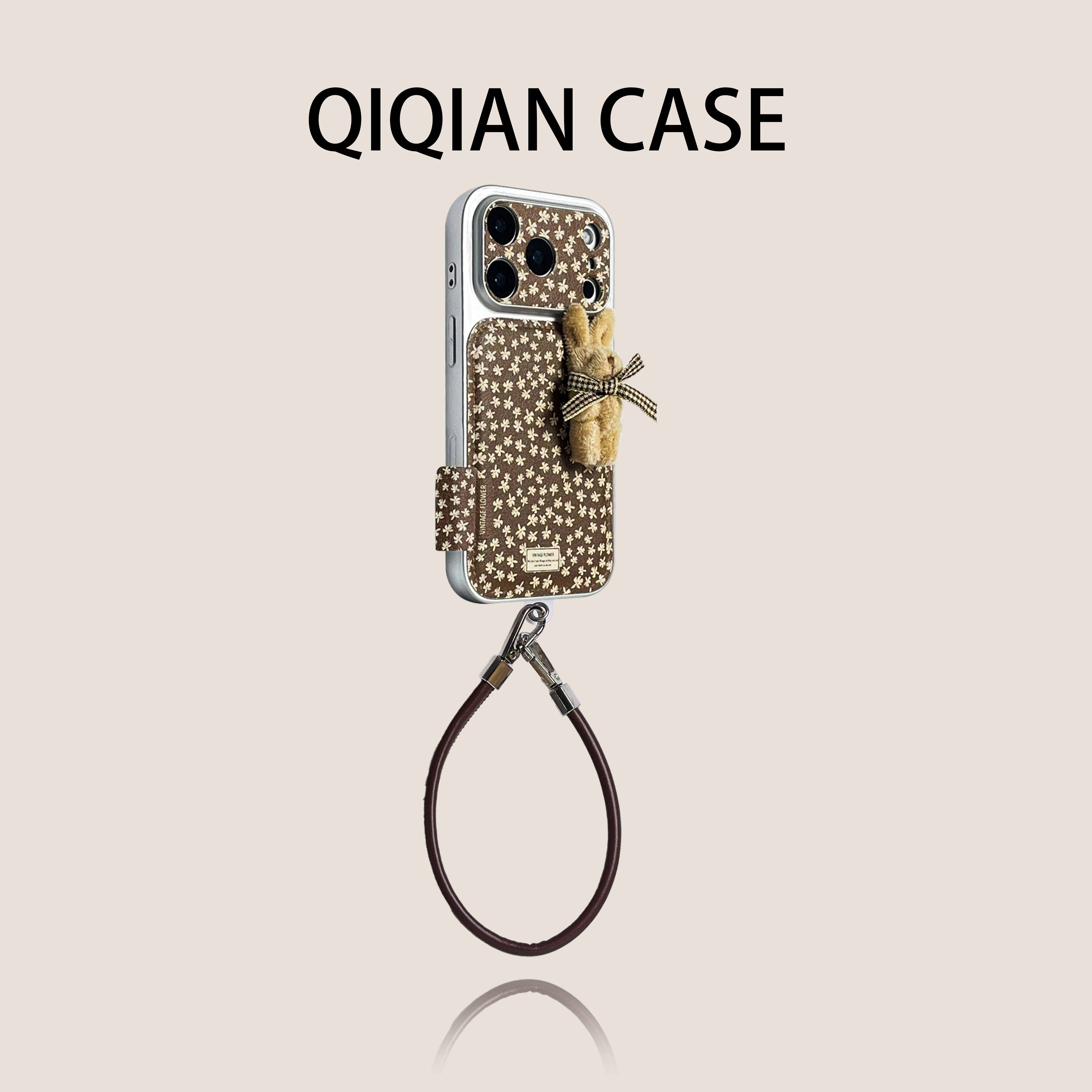 启乾 日韩鼓包皮纹棕底碎花立体兔子腕带iPhone17/16手机
