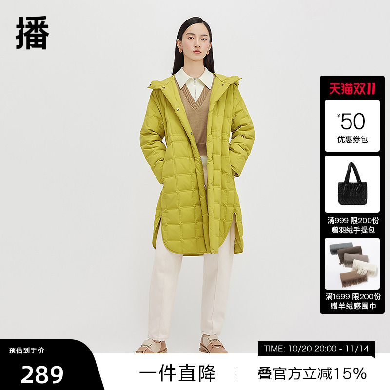 金属纽扣装饰，下摆弧形开叉