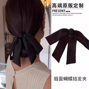 气质低丸子头黑色缎面蝴蝶结弹簧夹头饰2026新款后脑勺马尾发夹女