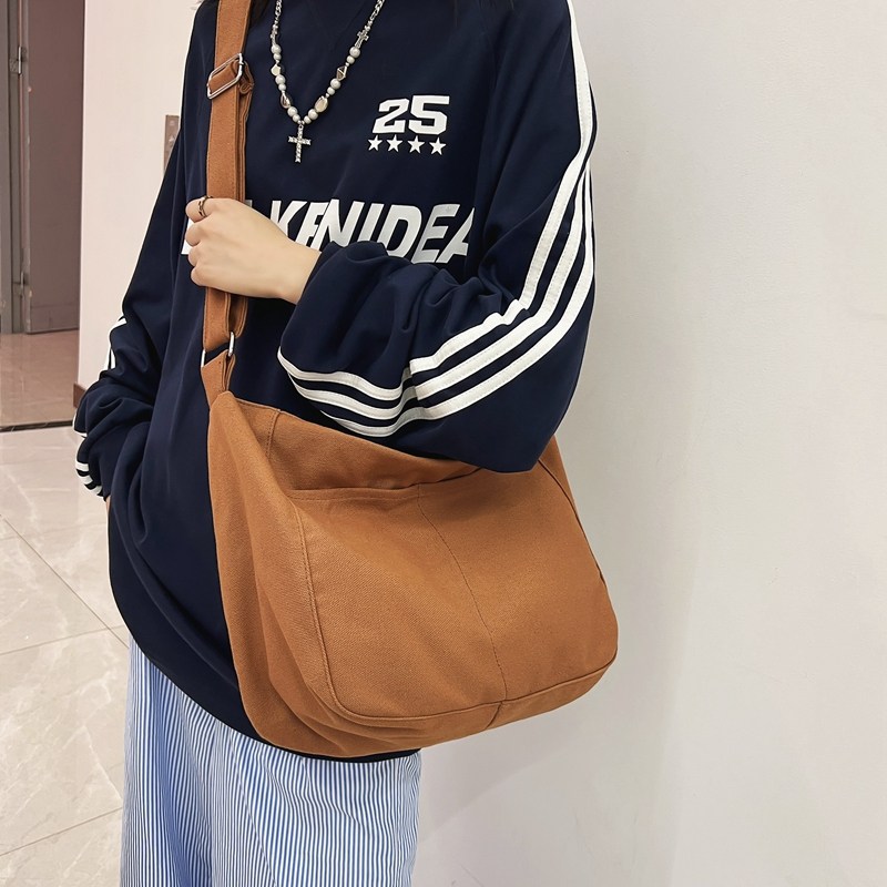 帆布包女2026新款上班通勤慵懒风文艺男大容量结实品牌单肩斜挎包
