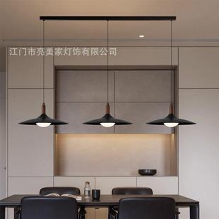 The chandeliers in the chandeliers of the walnut wood table,