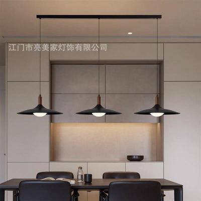 The chandeliers in the chandeliers of the walnut wood table,