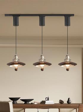 The chandelier at the restaurant is an advanced walnut-wood-