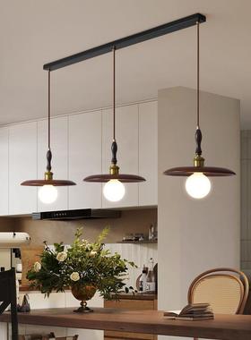 A chandelier for a trinity restaurant, a walnut wood bar, a