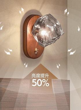The middle-winded bedside walllights are reminiscent of the