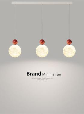 Three-headed chandeliers and a long-winded dining room light