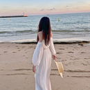 三亚旅行穿搭沙滩裙女夏高级感一字肩挂脖白色海边度假连衣裙超仙