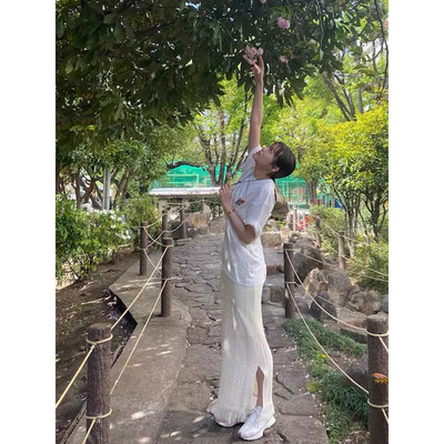 日单贵牌半身裙女春夏新针织镂空纯色编织流苏高腰中长款显瘦开叉