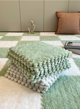 Plush carpet by the bed and foam floor mat in the bedroom