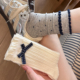 蝴蝶结袜子女中筒袜春秋款 纯棉ins潮流日系JK复古波点长筒堆堆袜