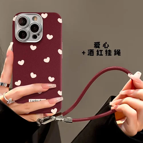 爱心波点挂绳适用苹果16红色手机壳15pro精孔皮纹14全包防摔13/12