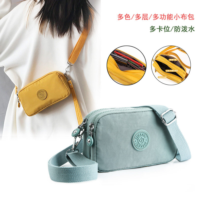 女士包包2021新款单肩斜挎两用帆布多层手腕防水零钱手机包旗舰店