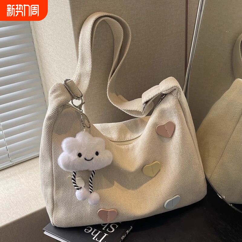 帆布包女2025新款潮秋冬简约百搭大容量单肩包休闲通勤斜挎饺子包