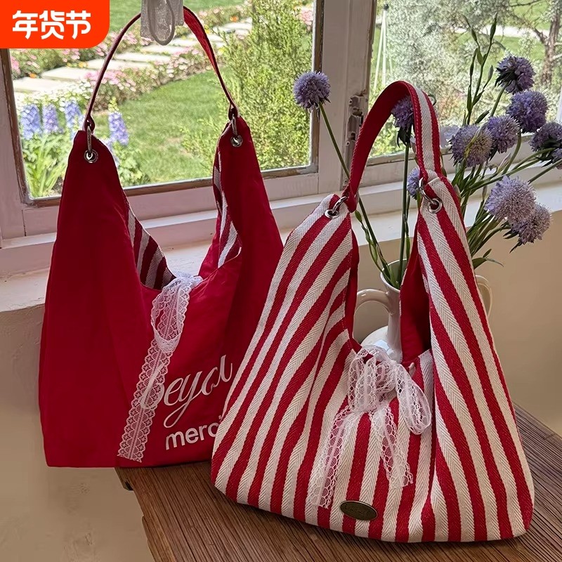 条纹帆布包包女夏天2025新款潮韩国字母印花双面单肩包学生上课包