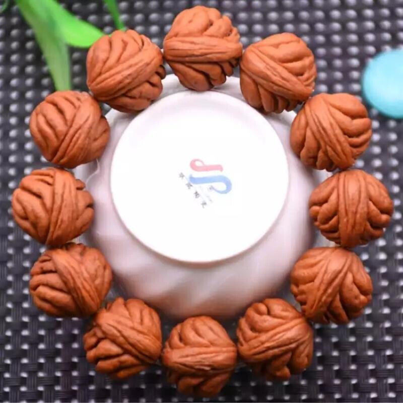 秦岭野外生龙纹桃核手串打底挂瓷霸王大肚文玩桃胡佛珠男金鱼肚