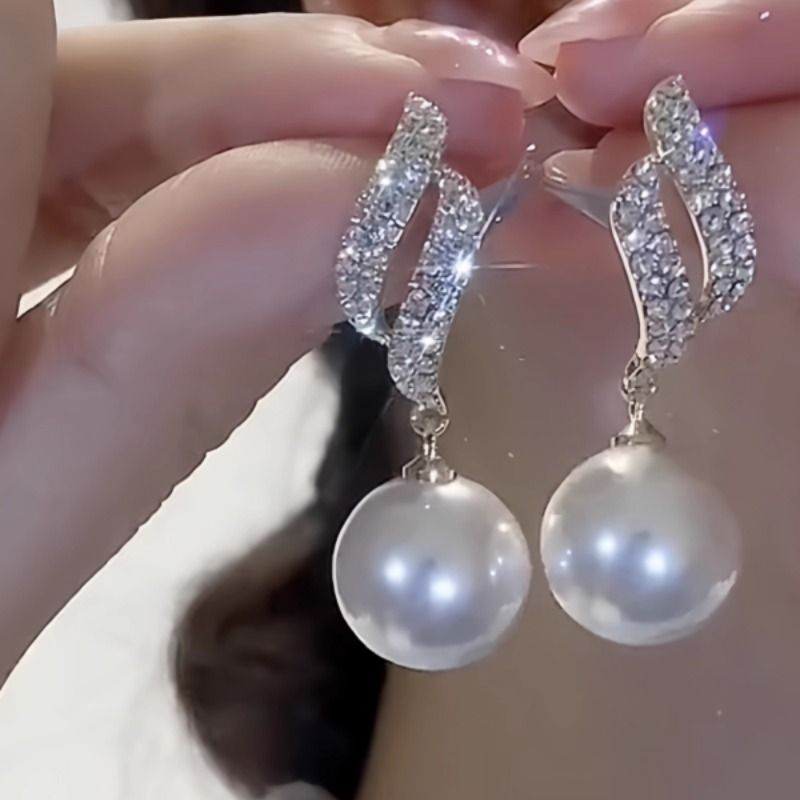 双向奔赴设计感珍珠耳环2025年新款潮气质耳饰网红百搭银针耳坠女