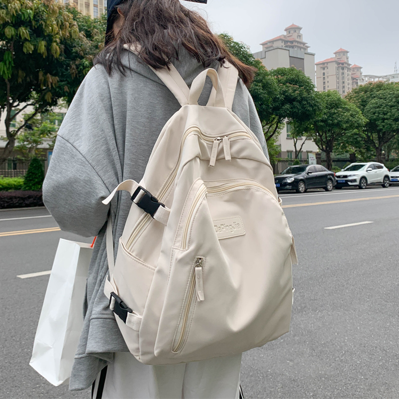 曼普森大容量书包女大学生旅行背包夏简约高中生小众原宿风双肩包