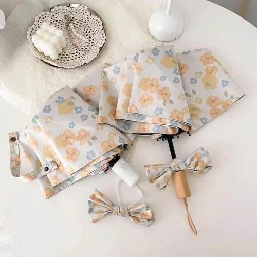 小黄花小巧黑胶太阳伞遮阳女晴雨伞紫外线两用防晒故事