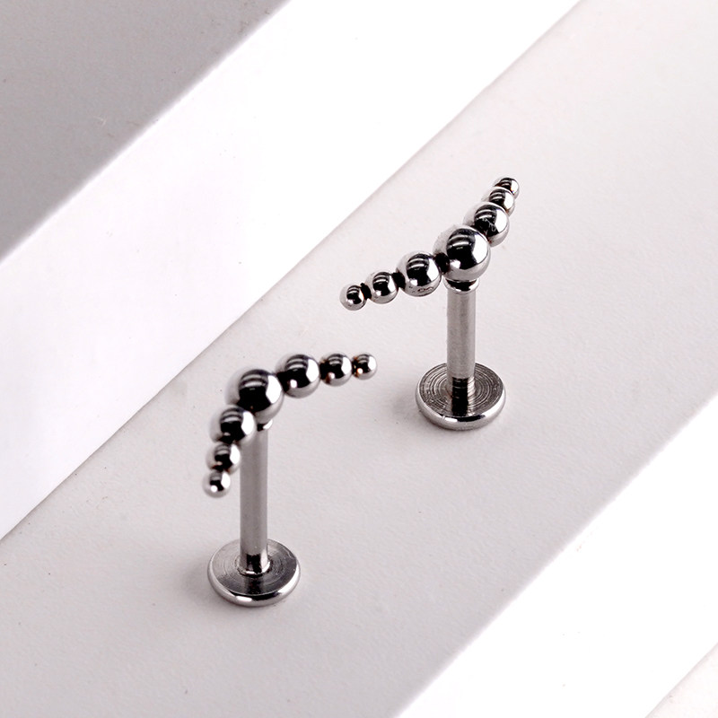 钛钢七星连珠唇钉内螺纹辣妹耳蜗钉小众个性女耳轮钉朋克穿孔饰品