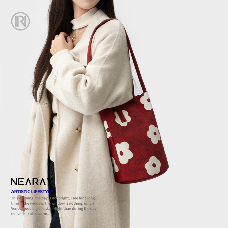 尼睿复古氛围感布艺小花水桶包