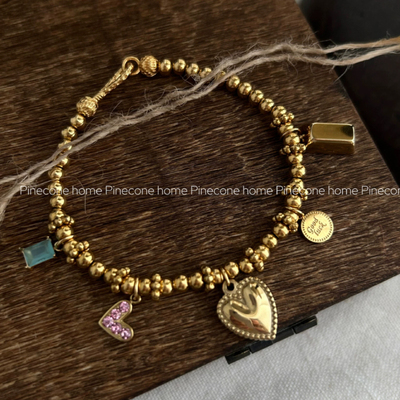 Pinecone钛钢纯银招财小金手链