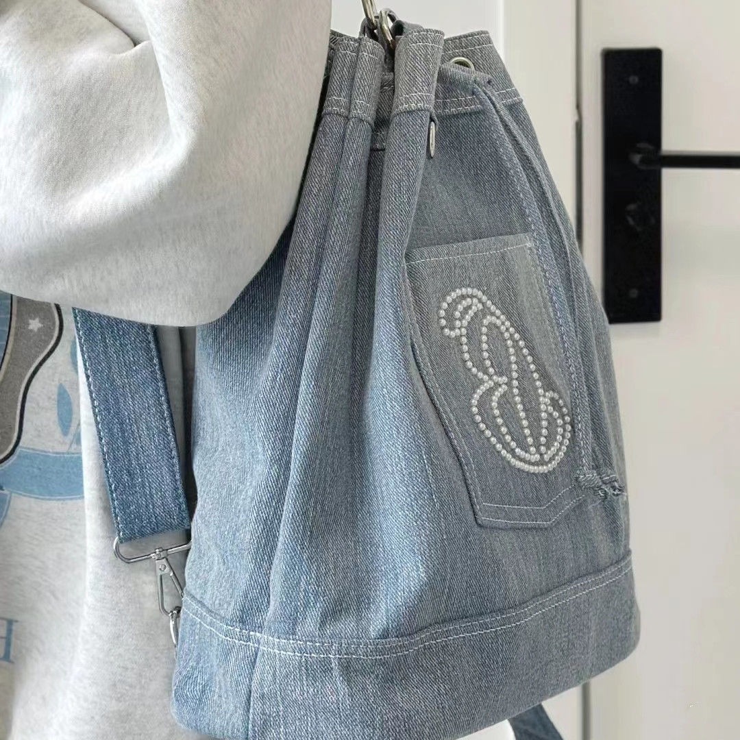 包包女2024新款休闲时尚双肩包大容量牛仔帆布水桶包学生通用书包