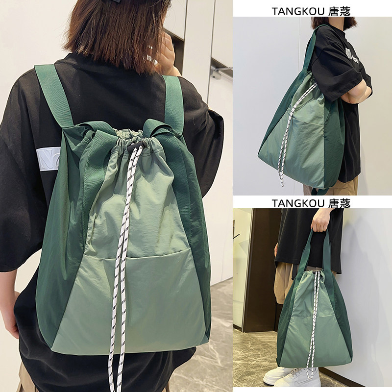 双肩单肩两用包包女2026新款旅行抽绳背包通勤托特大包帆布手提包