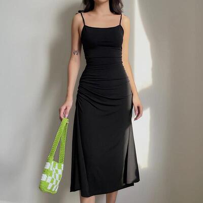 Black camisole dress with small pleats at the waist and