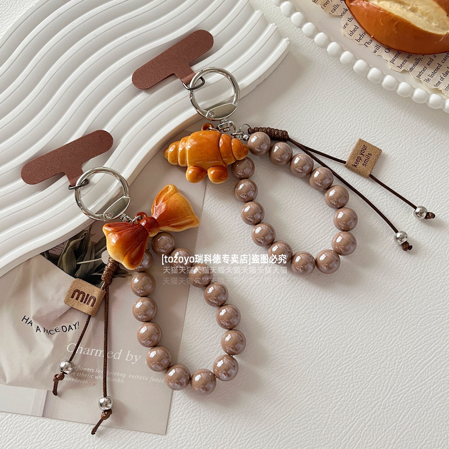 tozoyo碱水牛角包手机链手腕挂绳ins风编织蜡线蝴蝶结吊坠钥匙包包挂件棕色串珠原创挂链手链创意短款链条壳
