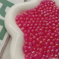 Розово-красные бусины разных размеров (50 г в упаковке)
