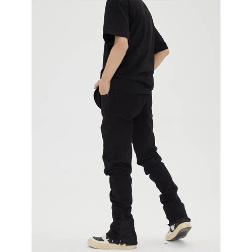 [陈慕驰]未知水洗拼接布破坏瞭破旧修身微喇叭牛仔黑裤