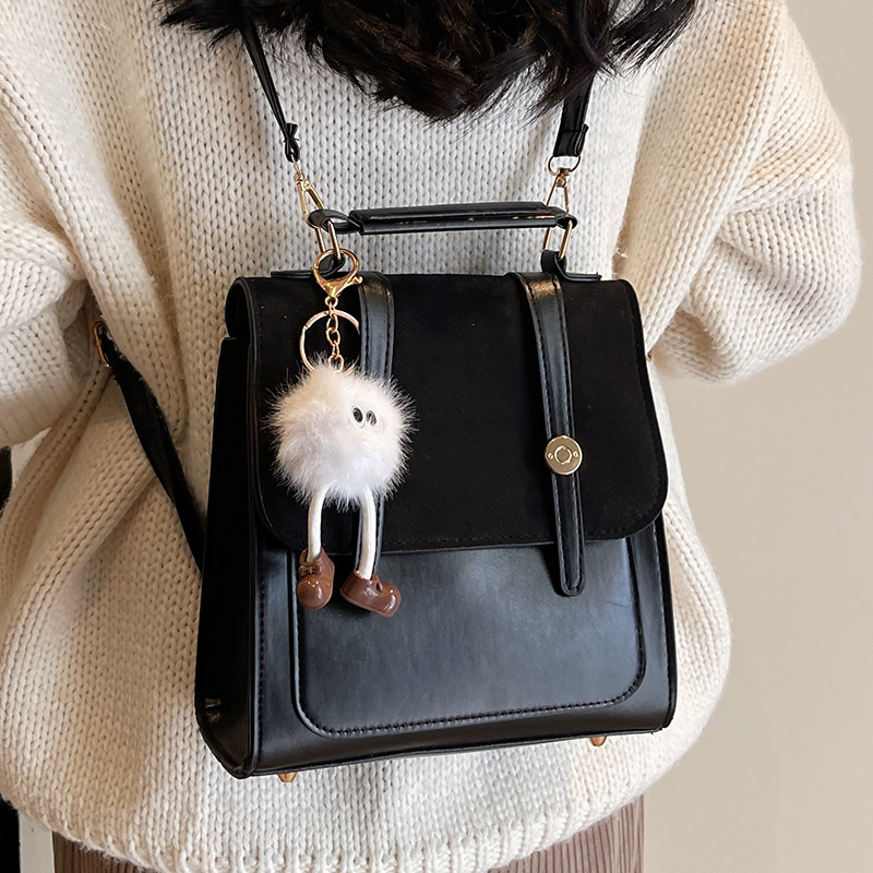 复古双肩包女2025冬季新款学院风多功能手提包毛球挂件黑色背包女