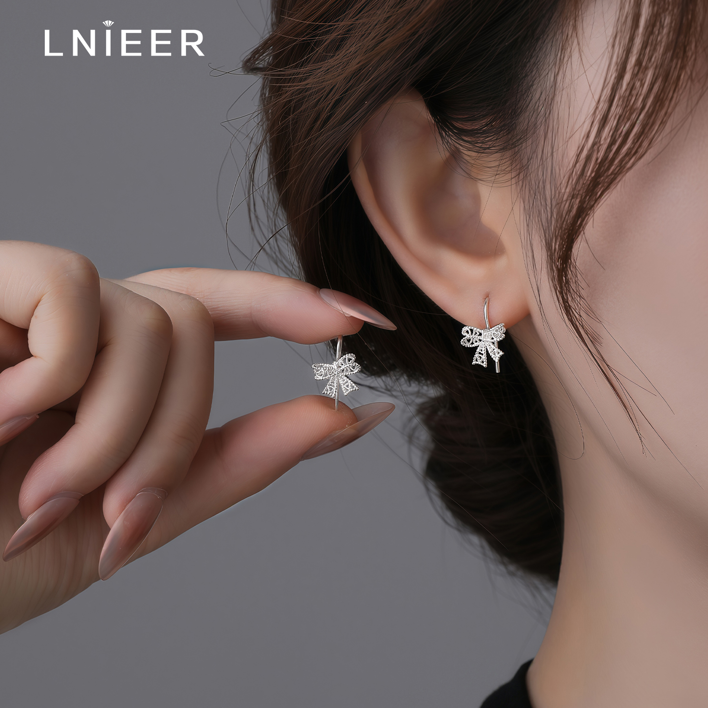999纯银镂空蝴蝶结耳环女养耳洞