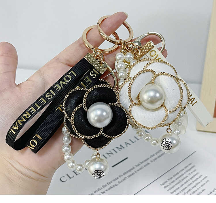 网红钥匙扣女爆款山茶花新款高端高颜值手机挂件链汽车包包挂饰坠