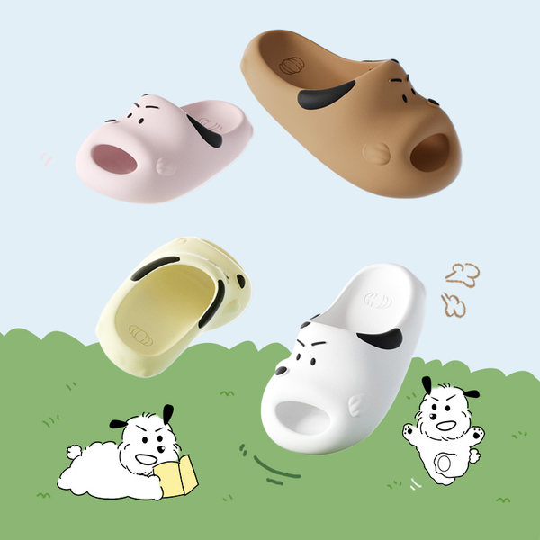 Colorful dog-themed slip-on clogs displayed on a pastel background