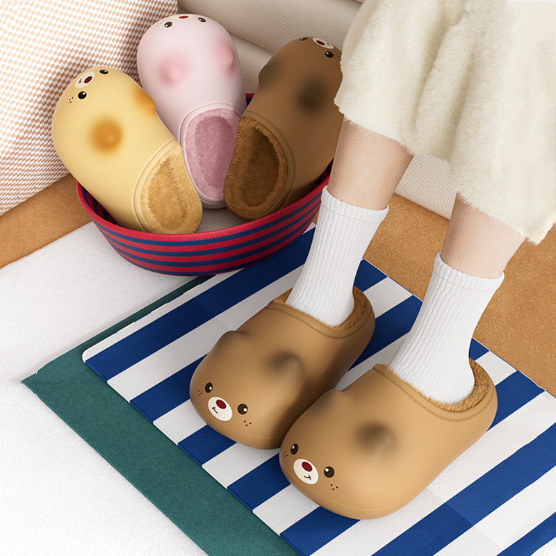 Cute bear-faced indoor slippers worn with white socks