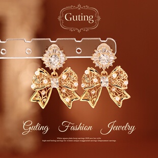 古婷金色蝴蝶结花朵锆石耳环女2026新款爆款高级感耳饰巨好看耳钉