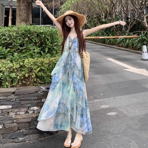 海边度假风印花小飞袖吊带连衣裙女2026夏季新款收腰不规则仙女裙