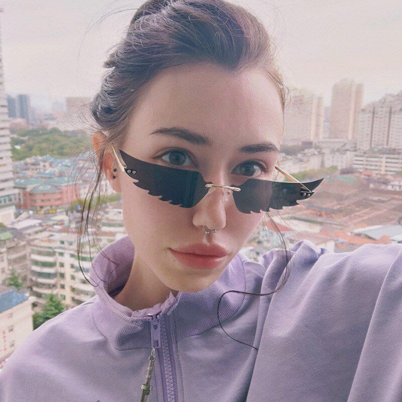 ins凹造型新款时尚炫彩猫眼太阳镜女欧美无框墨镜翅膀眼镜