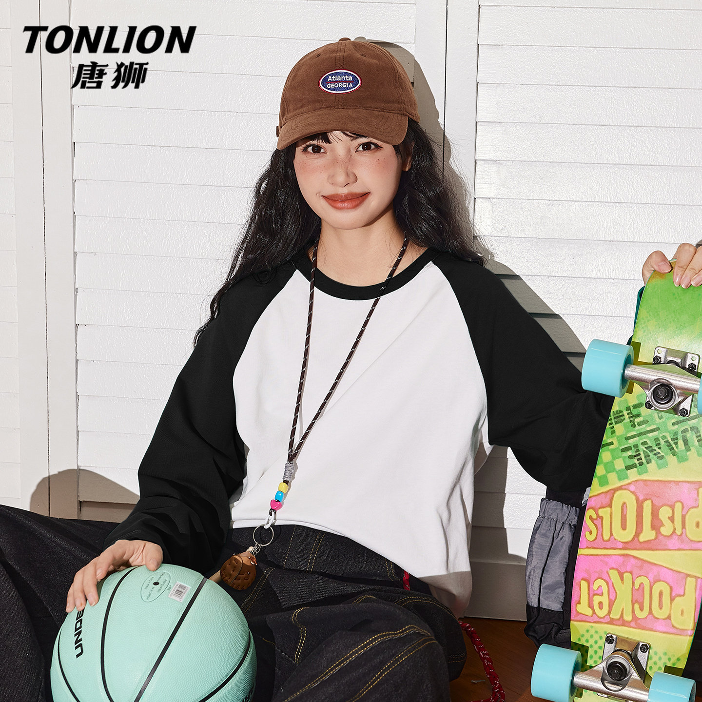 唐狮官方黑色长袖t恤女2026新款春秋款女款撞色插肩袖内搭上衣V