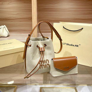 香港拉绳帆布水桶包包女2025新款时尚秋冬小众超火单肩斜挎子母包